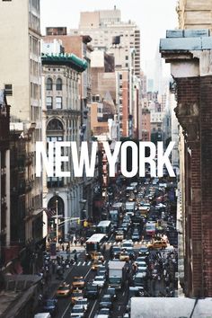 a city street filled with lots of traffic next to tall buildings in new york, usa