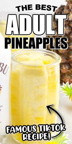 the best adult pineapples are in a glass jar next to some sliced pineapples