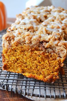 a loaf of pumpkin bread on a cooling rack