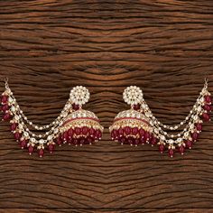 Add a regal look to your outfits with our Rani Pankhuri Earrings. These Gold-Plated beauties feature Kundan with Rani beads and a stunning Kaan chain design. Specifications Materials used: Kundan, Rani beads Length: 7.5 cm, Width: 6 cm Weight: 8.1 grams At Romikas, we pride ourselves on the craftsmanship and high quality of our jewelry, designed to enhance your natural beauty. Please contact us with any questions. Traditional Jhumkas For Eid Festival, Traditional Jhumkas For Eid Festivities, Traditional Jhumkas For Eid, Traditional Tilla Chandbali Jhumkas, Traditional Chandbali Tilla Jhumkas, Festive Stone Work Temple Jewelry Jhumkas, Traditional Stone Work Jhumkas For Eid, Traditional Stone Work Jhumkas For Festivals, Dangle Jhumkas For Diwali Festivities