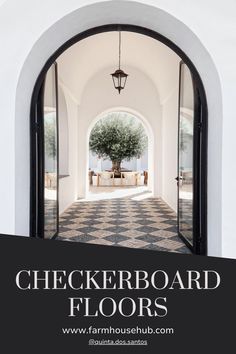 an arched doorway leading to a checkerboard floor with a tree in the center