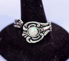 Vintage Gothic White Opal Ring The Vintage Gothic White Opal Ring is one of those pieces that will be treasured for years to come. Whether you wear this ring on your right hand or left, its elegant design and beautiful opdal stonare perfect accompaniments in any occasion GENERAL DESCRIPTION  Vintage Ring Color: Silver Tone Last photo includes measurements of ring. If you have any questions please feel free to message me! White Opal Ring, Vintage Gothic, Ring Color, Opal Ring, Vintage Ring, White Opal, Ring Vintage, Opal Rings, Right Hand