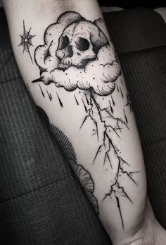 a black and white image of a skull with lightning bolt coming out of it's cloud