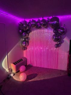 the room is decorated with balloons and streamers for a disco ball themed birthday party