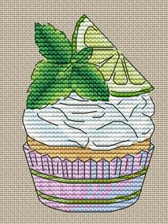 a cupcake with white frosting and a green leaf on top is featured in this cross stitch pattern