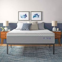 an image of a bedroom setting with mattresses and pillows on the side table in front of the bed