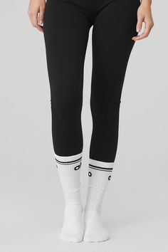 The best, barre none! The Throwback Barre Sock has all the features of a fave: a super-soft feel, comfy cushioning and classic stripe detail. Wear it tall or scrunched to barre class with leggings or shorts and get in the zone. Perfect for staying balanced at barre class Comfy cushioning Wear it tall or scrunched Women's Throwback Barre Socks in White/Black, Size: M/L (8-11) | Alo Yoga® Alo Sock, Comfortable Workout Socks, Comfortable Black Workout Socks, Comfortable Sweat-resistant Black Socks, Sporty Stretch Cotton Knee-high Socks, Sporty Cotton Knee-high Socks, Stretch Cotton Knee-high Sporty Socks, Sporty Black No-show Socks, Barre Socks