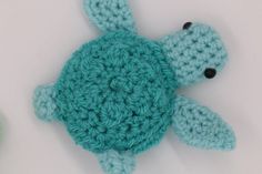 there is a crocheted turtle on the table