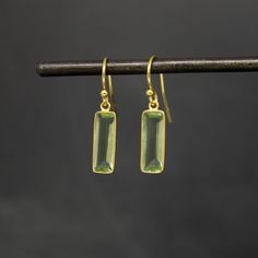 Simple rectangular green amethyst gemstone earrings in a gold vermeil setting with a hook fitting.  Dimensions (approx): * Length: 3cm  * Width: 0.5cm  Materials: * Gold Vermeil * Green Amethyst Beyond Biasa creates unique jewellery that is inspired by antique and tribal designs from around the globe. All of our pieces are handmade so please allow for slight variations in size and colour. Amethyst Earrings Gold, Green Amethyst Earrings, Tiny Pendant, Rectangle Earrings, Earrings Bridesmaid, Mini Hoop Earrings, Chakra Jewelry, Earrings Geometric, Aqua Chalcedony