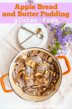 an apple bread and butter pudding in a dutch oven on a white tablecloth with purple flowers