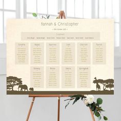 a wooden easer with an elephant and giraffe seating chart on it's side