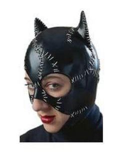 a woman wearing a black cat mask with spikes