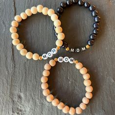 "This personalized chunky wood beaded stretch bracelet is a year-round classic to add to your bracelet stack -- and with your own choice of initial, name, word or phrase, it's the perfect gift! + 8mm round wood beads in Blonde, Blush or Black + letter beads available in black or white + 5mm gold-plated accent beads + stretch cords for easy on/off + four sizes: Extra-Small (6\"), Small (6.5\"), Medium (7\"), Large (7.5\") + packaged in a clear resealing bag for storage and gift giving PREFER GOLD Adjustable Wooden Bracelet With 8mm Beads, Wooden Bracelets With Round Beads For Gifts, Wooden Beaded Bracelets Perfect For Gifts, Wooden Beaded Bracelets For Gifts, Gift Natural Wood Round Bead Bracelets, Natural Wood Round Beads Bracelet Gift, Gift Natural Wood Round Beads Bracelet, Wooden Beaded Bracelets As Gift, Natural Wood Beaded Bracelets For Gifts