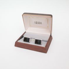 "Stunning vintage cuff links feature sleek black onyx framed in highly polished silver tone.  Marked with classic SWANK \"S\" emblem.   Onyx is smooth and richly colored. Silver tone has a beautiful antiqued patina.  Very minor touches of surface wear noted throughout upon close inspection.  Please refer to photos for details of condition.   Cuff Links are approximately .9\" wide and .7\" tall." Classic Polished Business Jewelry, Classic Engraved Jewelry For Business, Rectangular Polished Cufflinks For Formal Wear, Classic Rectangular Jewelry For Formal Occasions, Classic Rectangular Formal Jewelry, Formal Rectangular Jewelry With Polished Edges, Classic Rectangular Cufflinks For Anniversary, Formal Engraved Rectangular Cufflinks, Rectangular Engraved Cufflinks For Formal Occasions