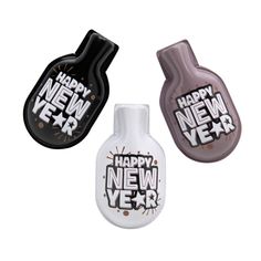 three new year air fresheners in the shape of bottles with happy new year written on them