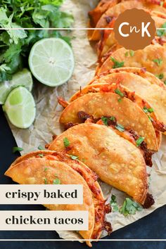 crispy baked chicken tacos with limes and cilantro on the side