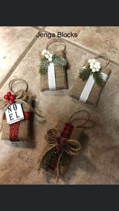 three small gift bags tied with twine and burlocks