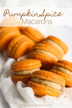 pumpkin spice macarons are sitting on a white cloth with the words, pumpkin spice macaroons