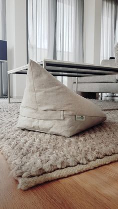 a pillow sitting on top of a wooden floor