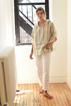 Crafted on the coast of Turkey, our Green Ivory Poncho is hand loomed using traditional techniques and woven with 100% premium Turkish cotton. Similar to a Turkish towel, it is highly absorbent, lightweight, eco-friendly, and quick to dry. We love it for its beautifully boho vibe and chic aesthetic. Experience how your poncho becomes softer and better with each and every wash! Care - Machine wash cold. Tumble dry low or line dry. Size - One size. H: 26" W: 31" *Please note: Due to the handmade n White Cotton Poncho For Vacation, Cream Casual Poncho, One Size Fits All, Green One-size Shawl Poncho, Bohemian Poncho For Outdoor, One Size, Beige Alpaca One-size Poncho, Spring Long-sleeved Cotton Poncho, Towel Wrap, Small Changes, Boho Vibe