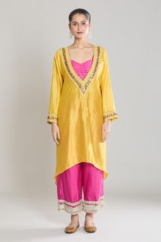 Yellow kaftan style kurta with sequin and thread embroidered neckline. Paired with a pink padded bustier and pant with embroidered hem. - Aza Fashions Traditional Spring Kurta With Sequins, Yellow Kaftan, Kaftan Kurta, Kurta Pant Set, Embroidered Hem, Kaftan Style, Women Kurta, Embroidered Neckline, Kurta With Pants