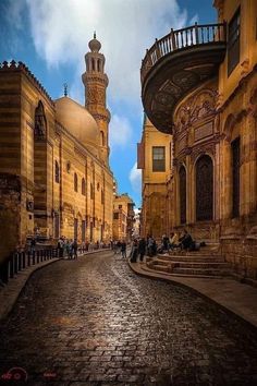 an old cobblestone street lined with buildings