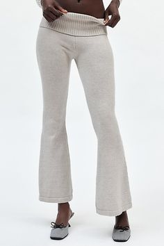 Lioness pant in a super cozy knit designed to be your new favorite. Features a mid-rise, ribbed knit foldover waistband and flared leg for a look that’s casual & chic. Features Lioness Muse knit pant Flare sweatpant Soft & stretchy knit Mid-rise with wide foldover waistband Slim fit from waist to calves Flare leg Full length Easy pull-on style Content + Care 49% Viscose, 28% polyester, 23% nylon Machine wash Imported Size + Fit Model in Grey is 5’8" and wearing size Small Measurements taken from Chic Ribbed Flare Bottoms, Ribbed Flare Pants For Loungewear, Flare Ribbed Pants For Loungewear, Flare Bottoms For Fall Loungewear, Non-stretch Flare Bottoms For Winter, Cozy Stretch Straight Leg Bottoms, Chic Flared Winter Bottoms, Soft Knit Cotton Bottoms For Fall, Fall Loungewear Flare Yoga Pants