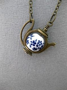 Forget Me Not Teapot Necklace OVERVIEW: This Necklace can be used with a lot of different themes in mind. If you are leaning towards a fairytale vibe, like Alice In Wonderland, then yes this will work for you. It also provides a simply charming vibe. And it is great for Tea Lovers. If you just love flowers, maybe Blue flowers, then maybe you'll fancy this necklace for that reason. But our absolute favorite way to think of this necklace, is of course, with the Forget Me Not theme in mind. Forget Teapot Necklace, Alice In Wonderland Gifts, Alice In Wonderland Birthday, Cadeau Diy, Tea Lovers, Funky Jewelry, Brass Necklace, Forget Me Not, Dream Jewelry