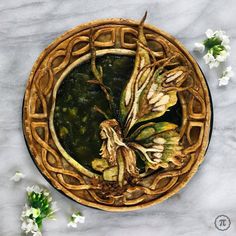 a painting of flowers in a basket on top of a marble table with white flowers around it