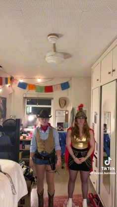 two people dressed up in costumes standing next to each other