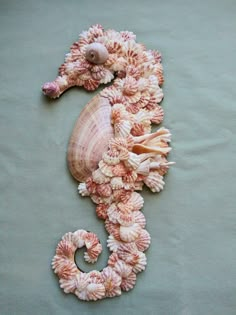 a seahorse made out of seashells and shells