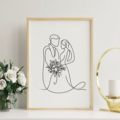 a drawing of a bride and groom sitting next to each other on a mantle with flowers