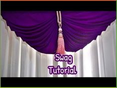 a purple curtain with a tassel hanging from it's end and the words swag