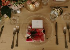 a place setting with flowers and silverware