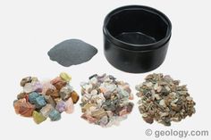 various rocks and gravels are shown in this image, including a black bowl with rock chips