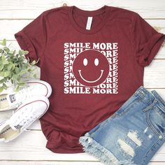 Smile Often Shirt - Smile Tee- Cute Smile Shirt- Retro Smile tee- Smile Often shirts- Retro Smile Shirts - Retro Hippie - Trending for Teen SMILE OFTEN RETRO SHIRT ** Please add the saying you would like to each shirt - include to add on the back . If you have any questions, feel free to ask. Adult Unisex Triblend short sleeved Crew Neck. 50% Poly 25% Combed Ring-Spun Cotton 25% Rayon This shirt is Unisex so for a female, it is a looser fitting shirt. I always get asked about sizing... here is t Everyday Funny Print Crew Neck Shirt, Everyday Crew Neck Shirt With Funny Print, Red Tops With Funny Print And Relaxed Fit, Red Tops With Funny Print In Relaxed Fit, Funny Print Crew Neck Top For Everyday, Short Sleeve Shirt With Funny Print For Everyday, Funny Text Crew Neck Tops For Everyday, Everyday Crew Neck Top With Funny Text, Short Sleeve Tops With Funny Text