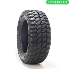 an image of a truck tire on a white background with the words high tread written below it