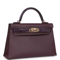 This Kelly, in the Sellier style, is in Cassis and Amethyst Madame leather and Shiny Alligator with permabrass hardware and has tonal stitching, two front straps with front toggle closure, single rolled handle and removable shoulder strap.The interior is lined with Cassis lambskin and has one open pocket on the back wall.Collection: BOrigin: FranceCondition: New (plastic on hardware)Accompanied by: Hermès box, Hermès dustbag, shoulder strap, shoulder strap dustbag, felt, carebook, and CITESMeasu Dream Items, Mini Kelly, Hermes Box, Fancy Bags, Hermes Bags, Hermes Birkin, Luxury Handbags, Alligator, Luxury Bags