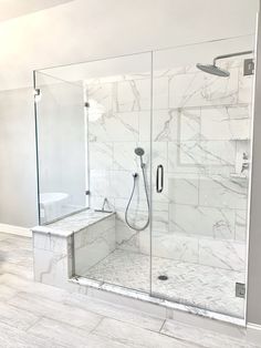 a walk in shower sitting inside of a bathroom