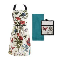 a white dress with red and blue flowers on it, next to a teal napkin