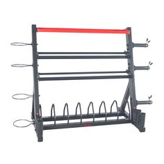 the wall mounted rack is holding several pairs of hooks and two red bars on each side