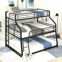 the bunk bed has two sets of mattresses on it and is black in color