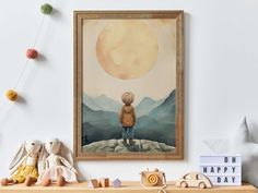 a child's artwork hangs on the wall above a shelf with stuffed animals and toys