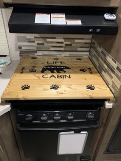 a stove top with the name cabin on it