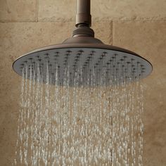 a shower head with water flowing from it