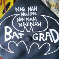 a graduation cap with the words bat - grad written on it