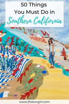 a woman standing in front of a colorful wall with the words 50 things you must do in southern california