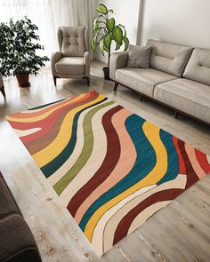 a living room with two couches and a rug on the floor