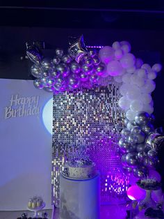 a birthday party with balloons and cake