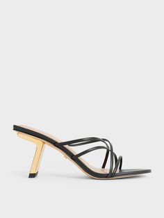 If you are looking for a pair of heels that can take you effortlessly from day to night, then these are the ones to consider. These Orly mules feature an intricate and eye-catching strappy design that will instantly elevate any look, be they formal occasionwear or casual summer fits -- all you need to do is to just slip them on and go. Sitting on metallic gold slant heels, these shoes will boost your stature with a sleek and polished finish. Casual Summer Fits, Heel Mules, Size Chart For Kids, Charles Keith, Summer Fits, Shoe Size Chart, Metallic Gold, Trending Shoes, Summer Casual